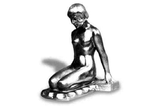 Nude, sitting on heels